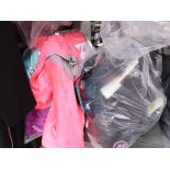 Bag containing 12 kids fleeces with bag of ladies comfort bras