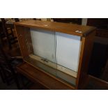 Mid century teak hanging display rack with glass sliding doors