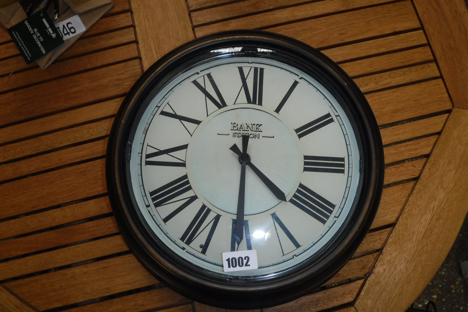 Battery operated garden wall clock