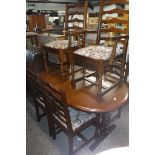 Dark oak extending dining table and 6 matching floral upholstered chairs *Collector's Item: Sold