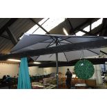 Beige garden parasol with metal pole