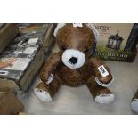 Brown leather teddy bear doorstop