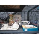 Cage with vase, place mats, crockery, loose cutlery and a part tea service