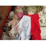 Box containing dolls