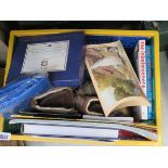 Box containing books, atlases, and shoes