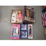 Box containing Penny, Cindy and other dolls