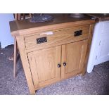 (1) Light oak mini sideboard with single drawer and double door cupboard (significant damage to