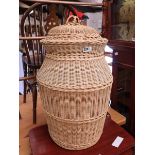 Lidded wicker laundry basket