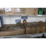 Shelf containing 4 boxes of canine kitchen dog treats