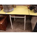 Mid century metal framed kitchen table with yellow surface and drop sides