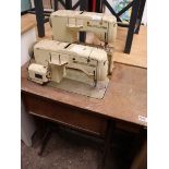 Dark oak sewing machine stand containing Bernima 740 electric operated sewing machine, no pedal or
