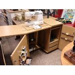 (3) Beech effect sewing machine cabinet with contents incl. Elna 6004 model 0003883 sewing machine