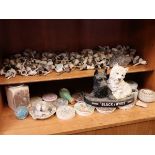 Shelf of paced lids, Scotty dog black and white scotch ornament and shelf of clay pipe finds