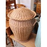 Wicker lidded laundry basket