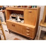 Mid century teak sideboard, upper section having fall front cabinet and open front shelving, lower