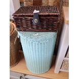 Green painted cylindrical wicker laundry basket and 1 further wicker picnic basket