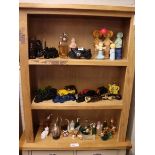 3 shelves of collectible novelty cologne bottles