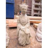 Concrete statue of Oriental lady