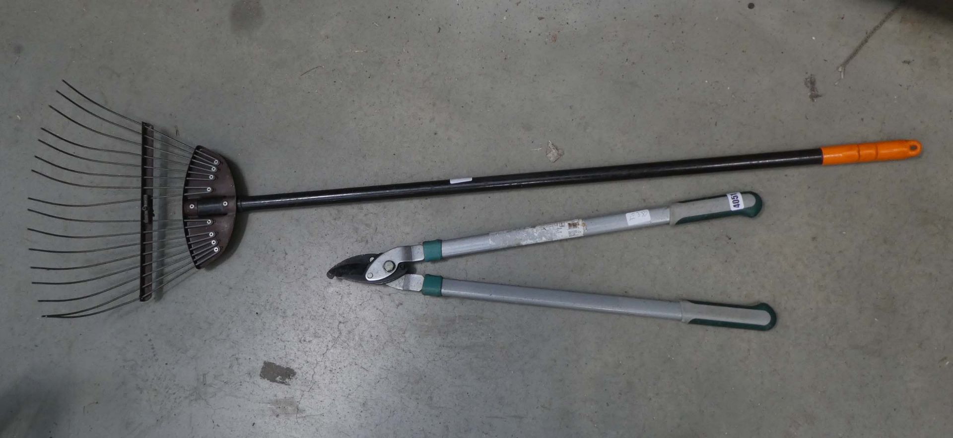 Pair of loppers and a garden rake