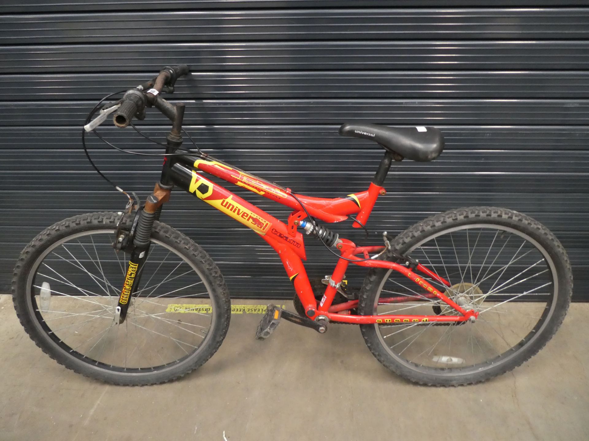 Yellow and red Universal suspension mountain bike