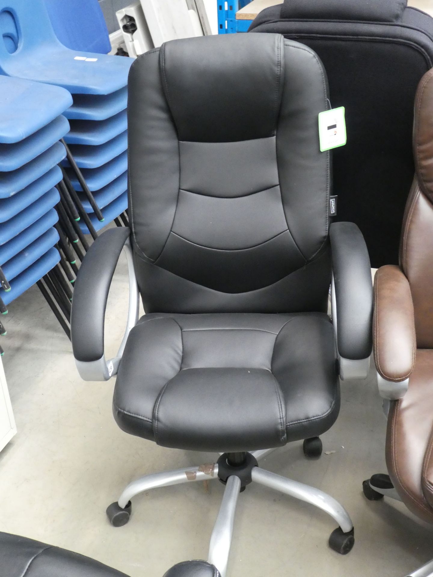 Black high backed swivel armchair