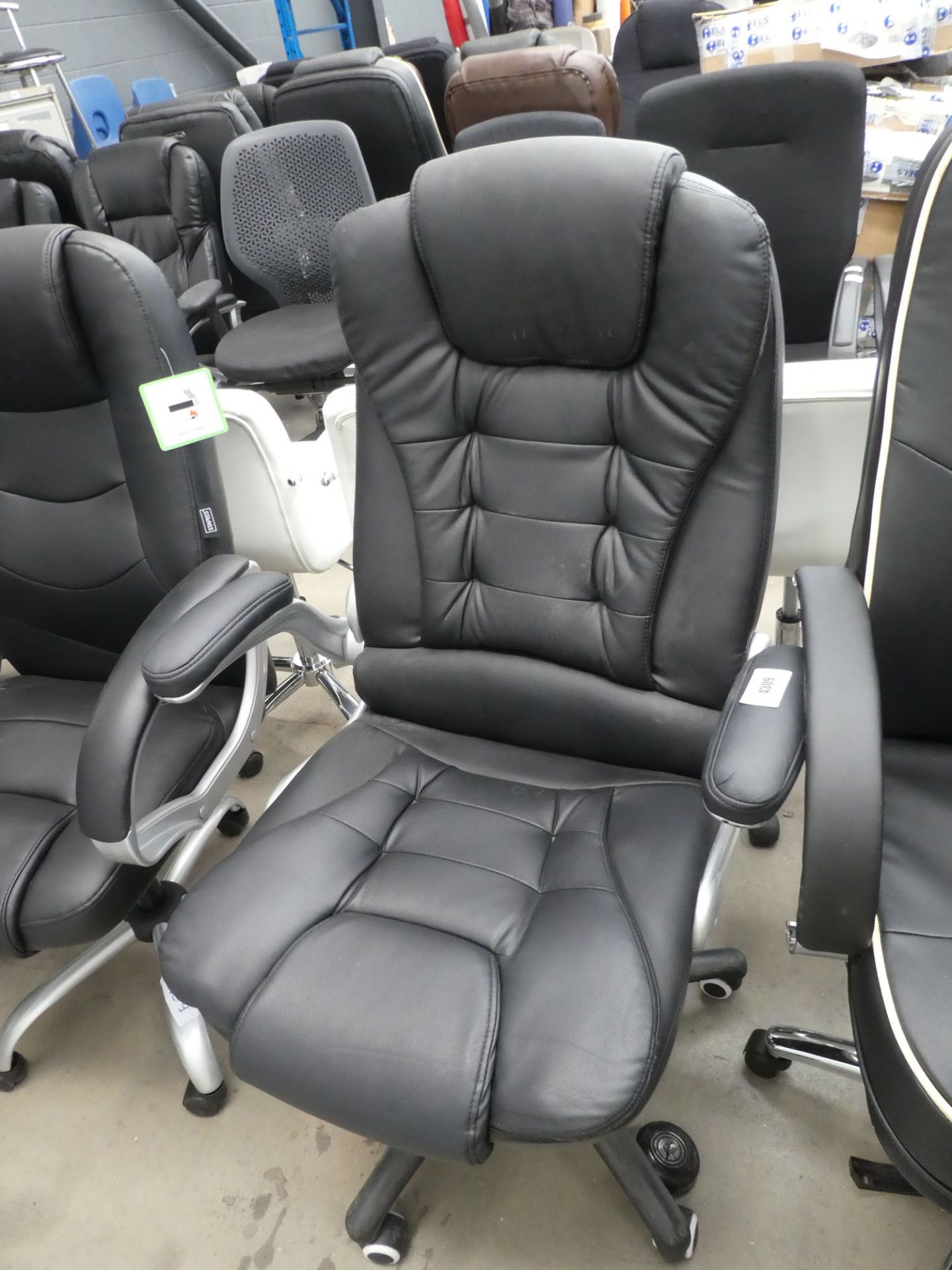 Black high backed swivel armchair