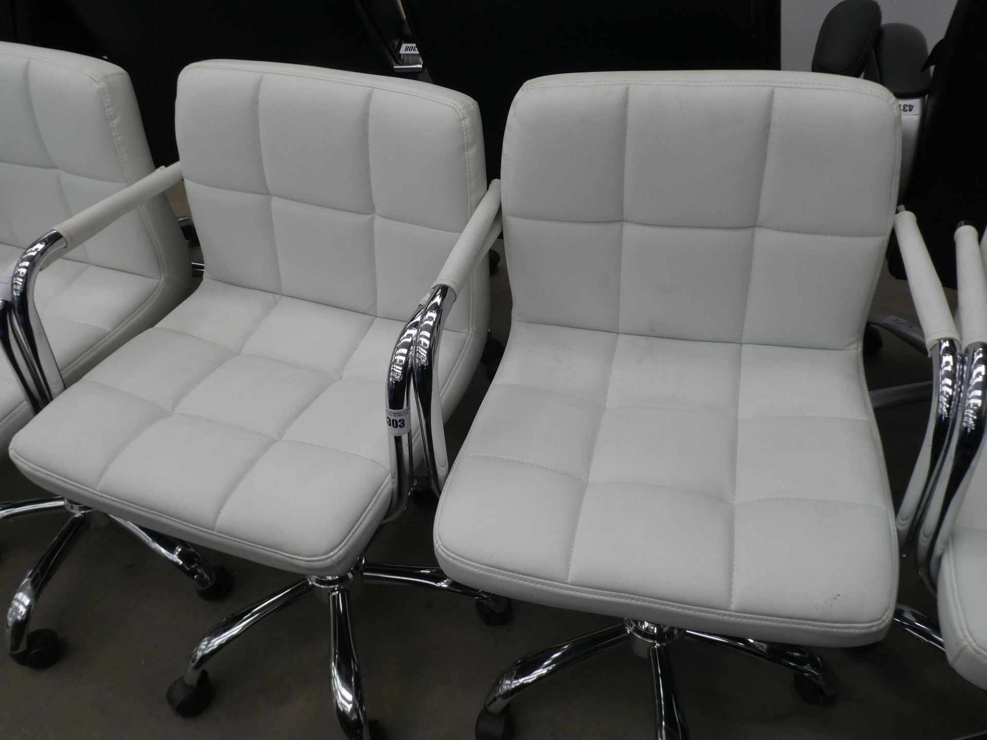 2 white chrome framed armchairs