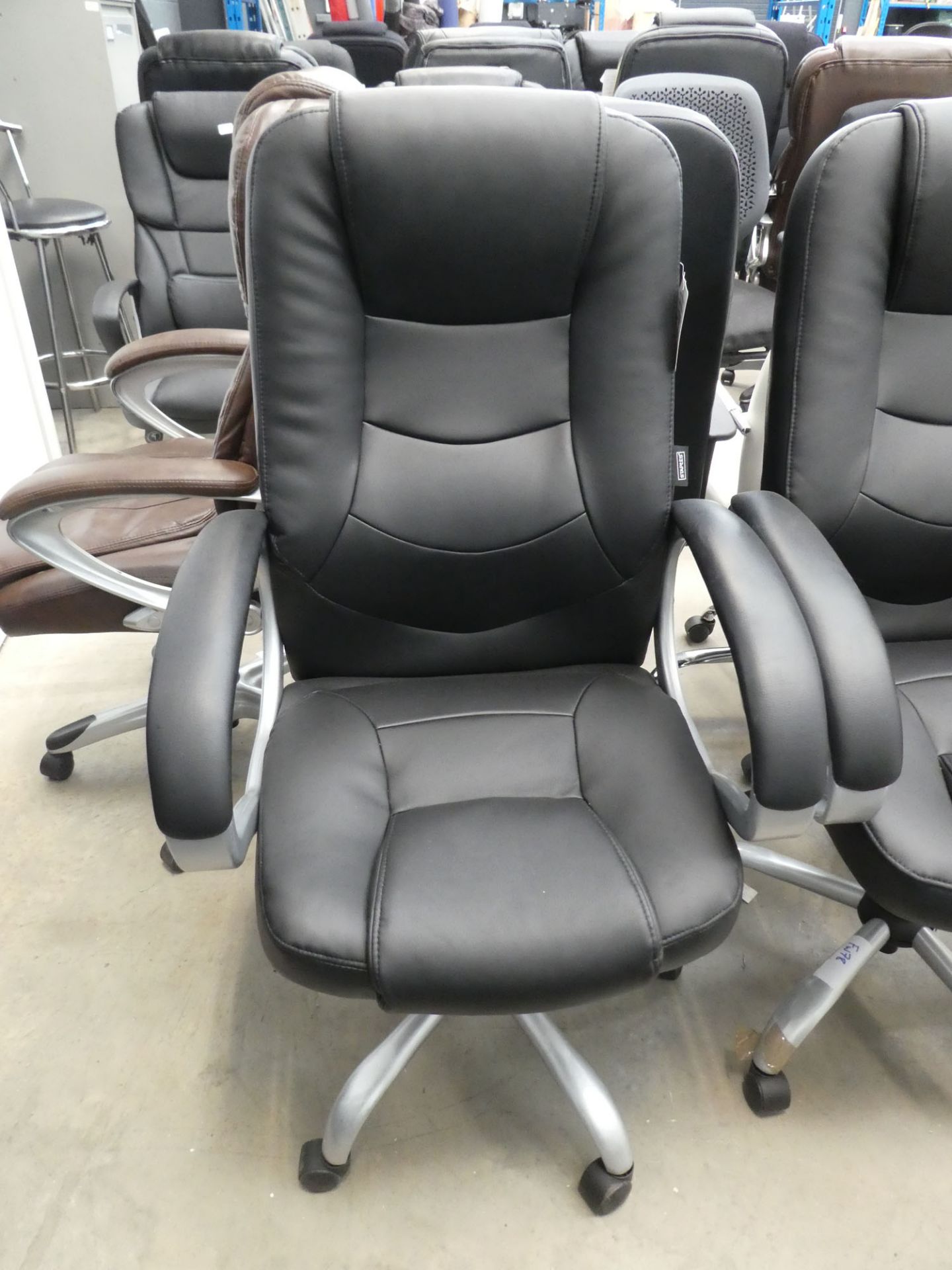 Black swivel armchair