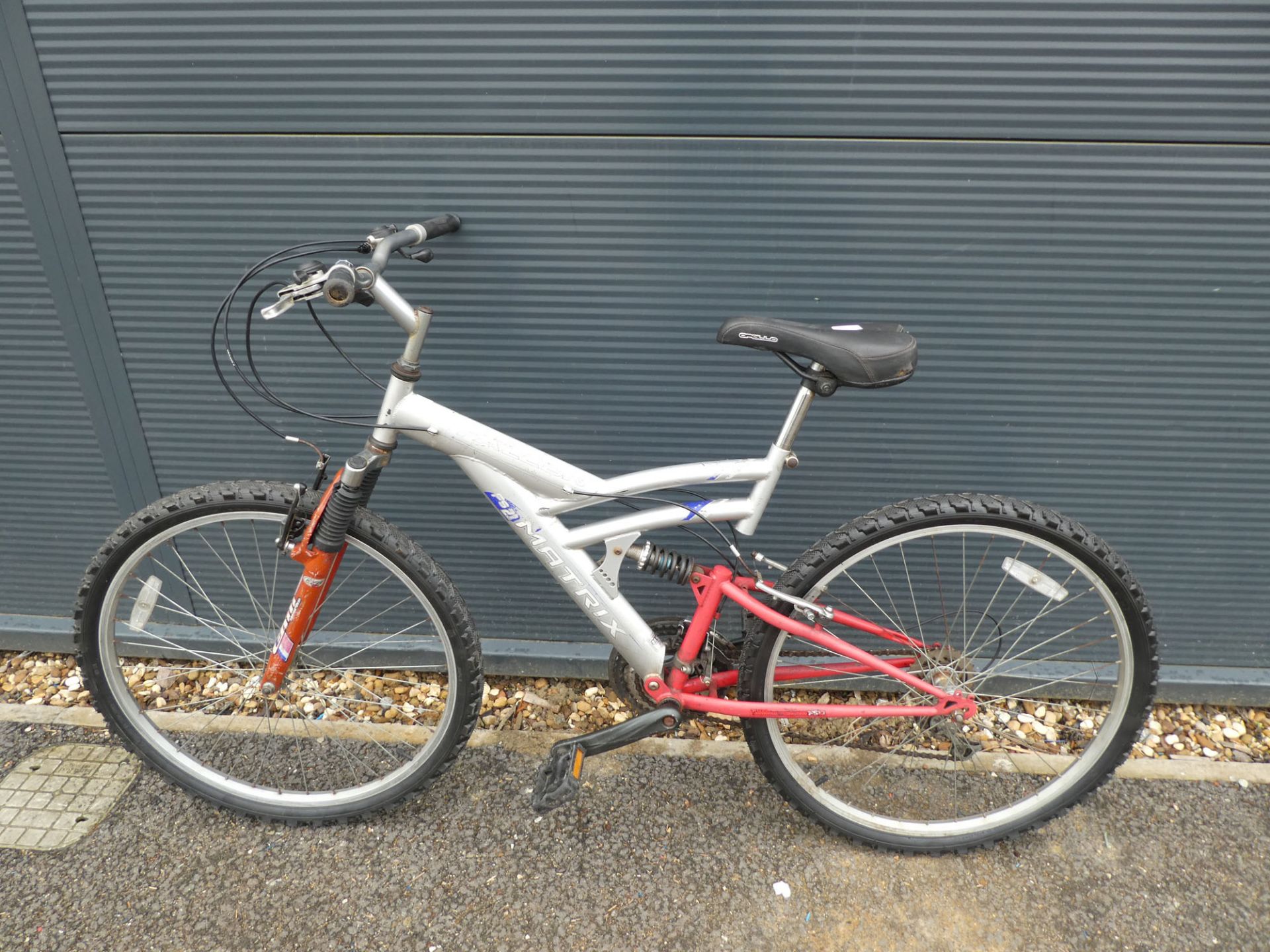 Falcon silver and red suspension mountain bike