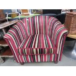 Tub chair in cream, black and red striped fabric