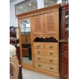 Satin walnut wardrobe with cupboards and drawers to side and single mirrored door