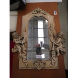 Mirror with cherub decorated frame