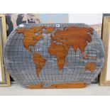 Wooden cutout map of the world on metal board