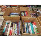 4 boxes containing antique guides, photographic reference books, health books and novels