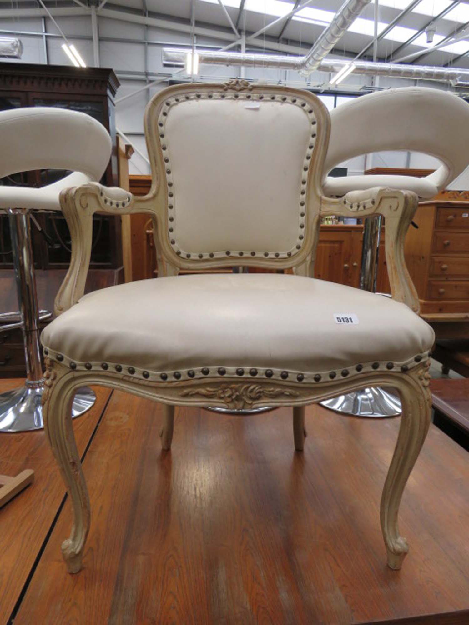 Cream painted ornate French style armchair