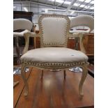 Cream painted ornate French style armchair