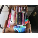 Box containing dictionaries and novels