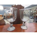 Pair of large metal and glazed candlesticks