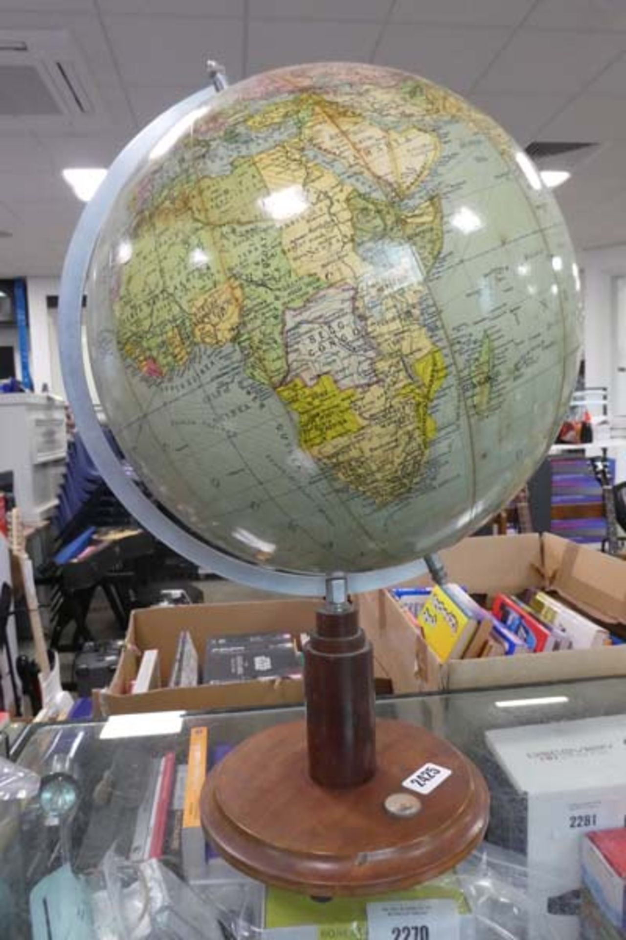 Vintage globe on wooden stand with built in compass