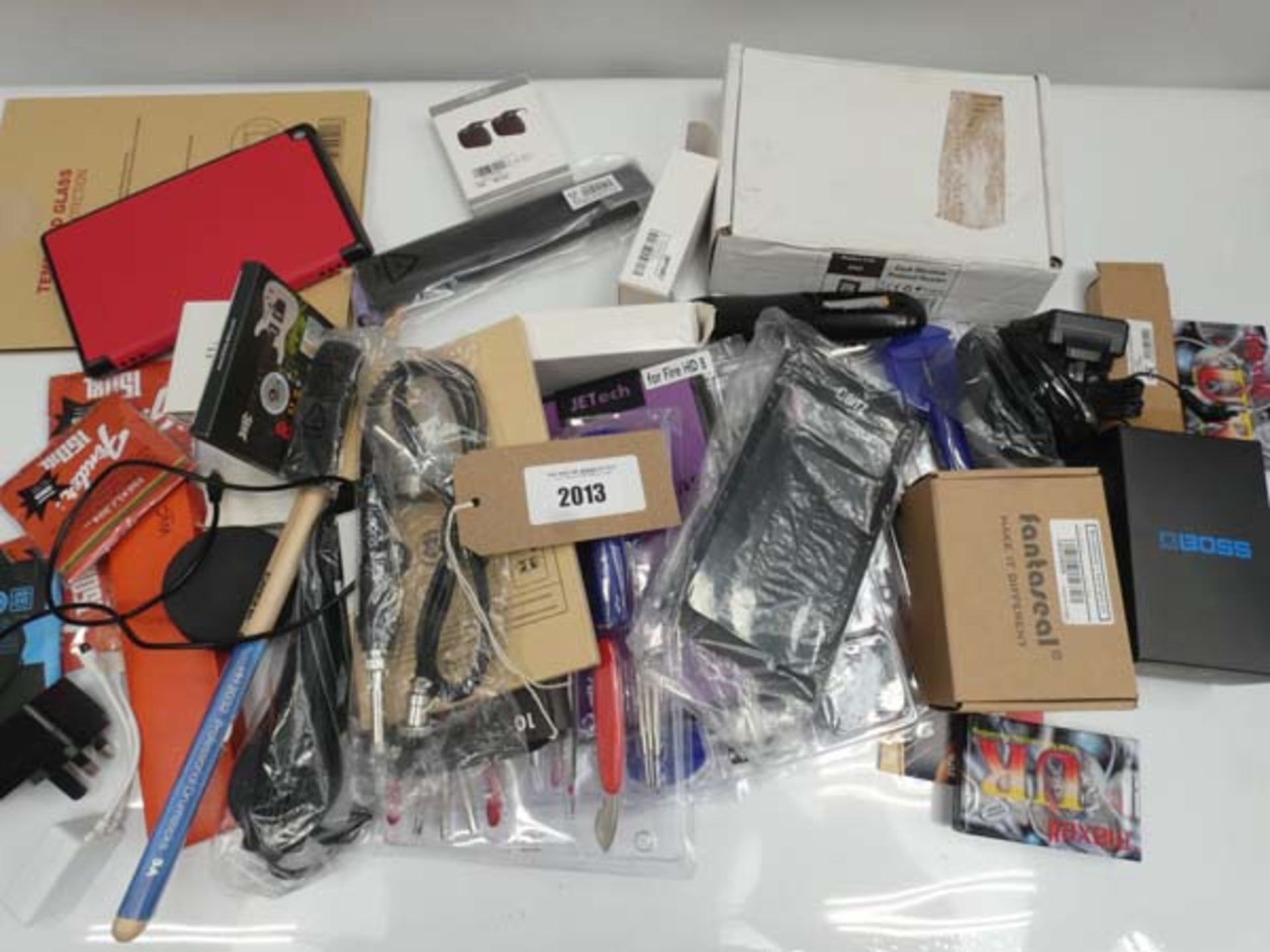 Bag containing watch repair kits, guitar pedal, keypad reader, tablet cases, drumsticks etc