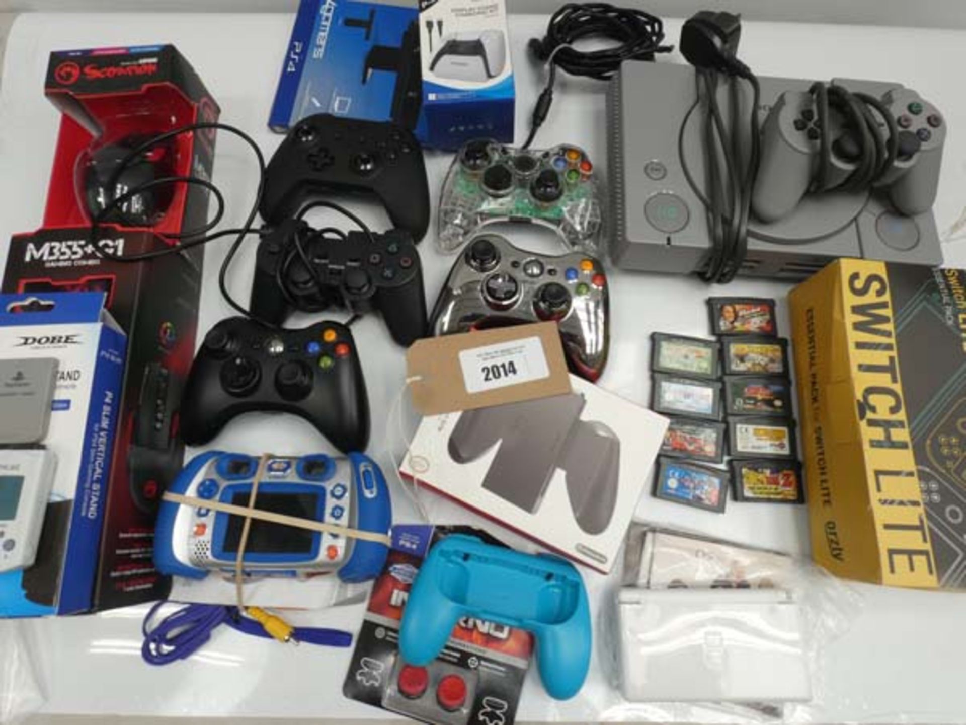 Bag containing gaming related accessories; PS1 console, Nitntendo DS, Gameboy Advance games,