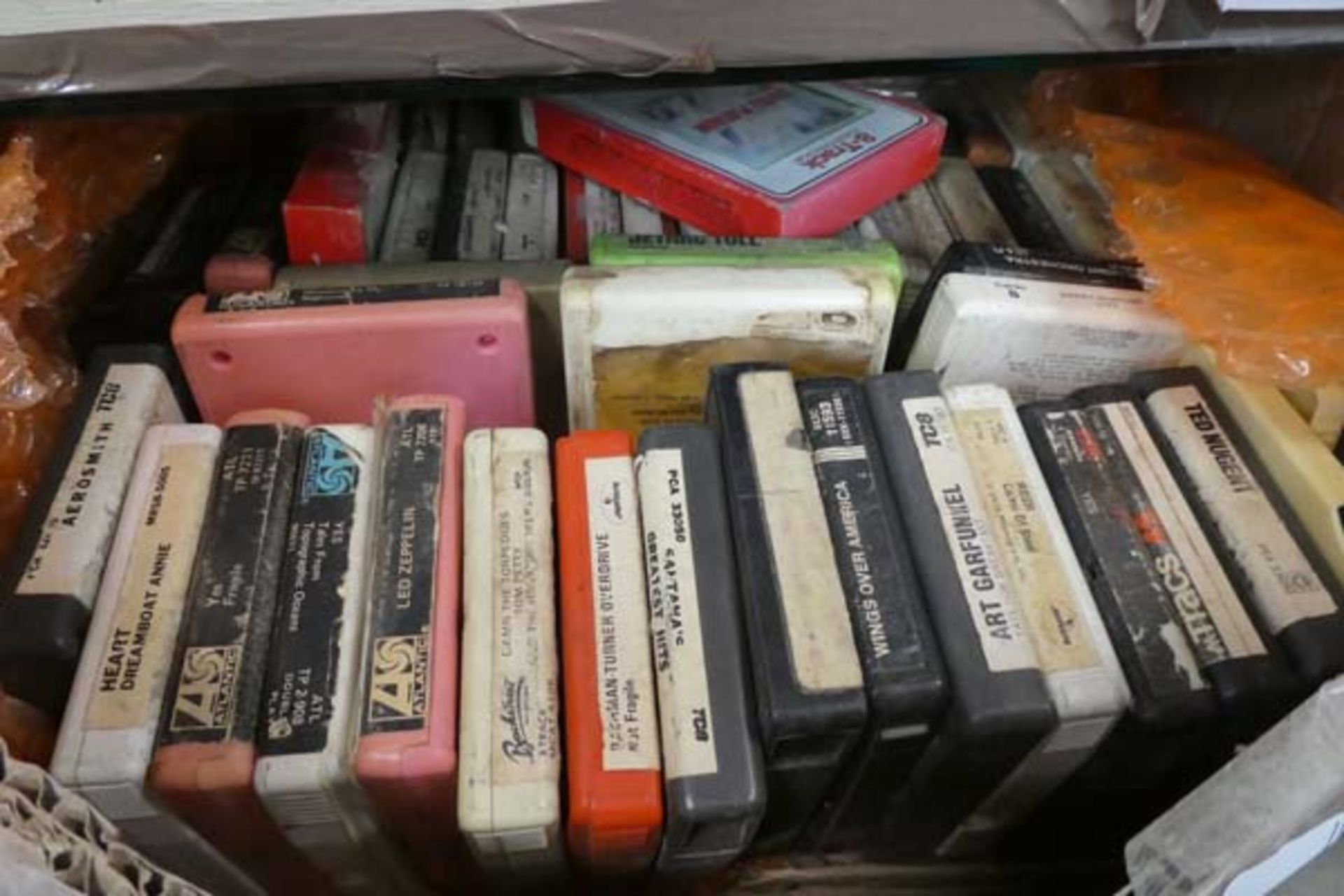 Box containing wide selection of 8-track cassettes inc. Led Zepellin, Yes, Ted Nugent and other