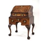 An 18th century-style walnut and crossbanded ladies bureau-on-stand,