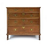 An early 18th oak chest of drawers with an arrangement of two short over three long graduated