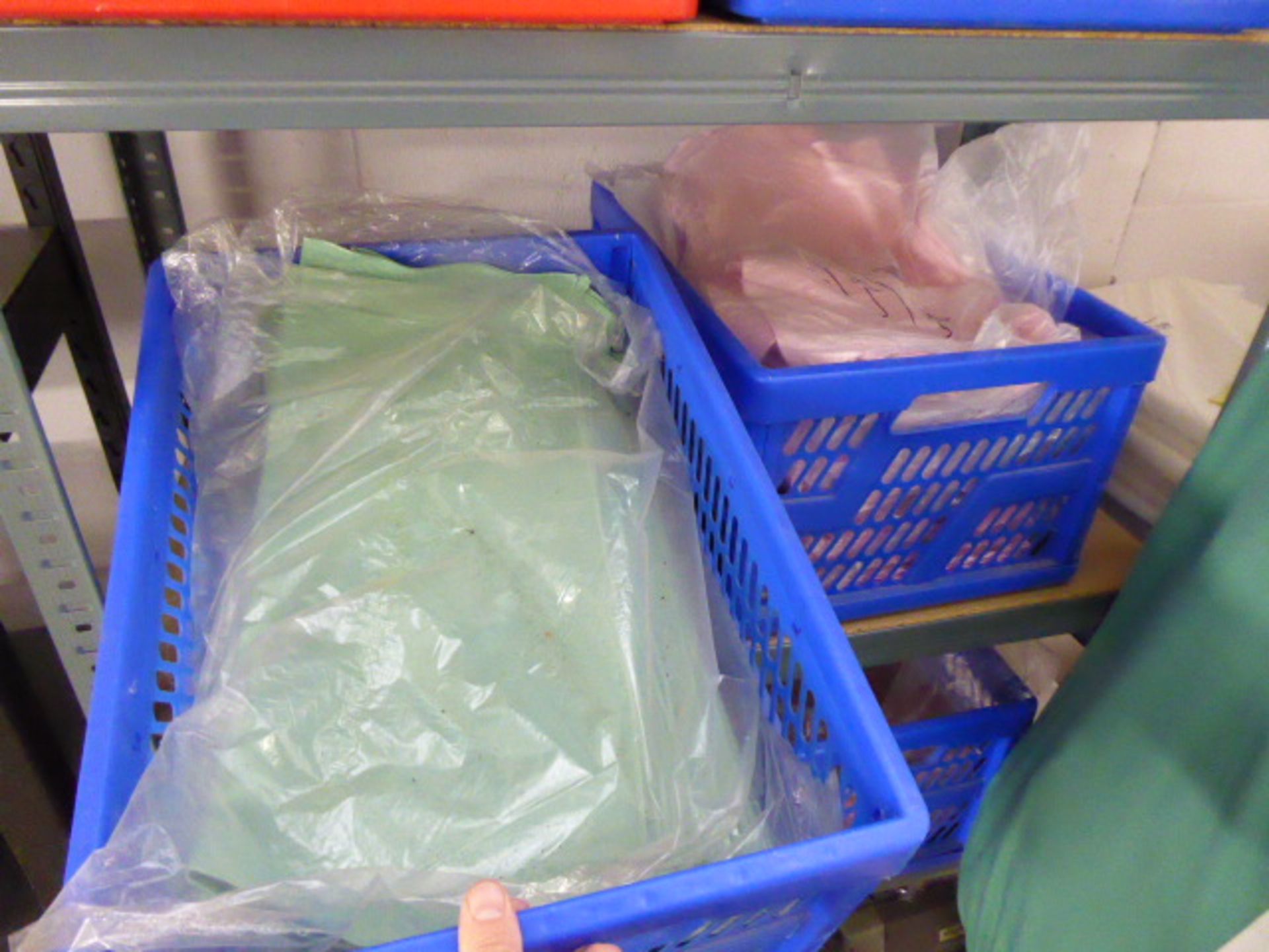 10 plastic crates of assorted coloured linen 16'' napkins
