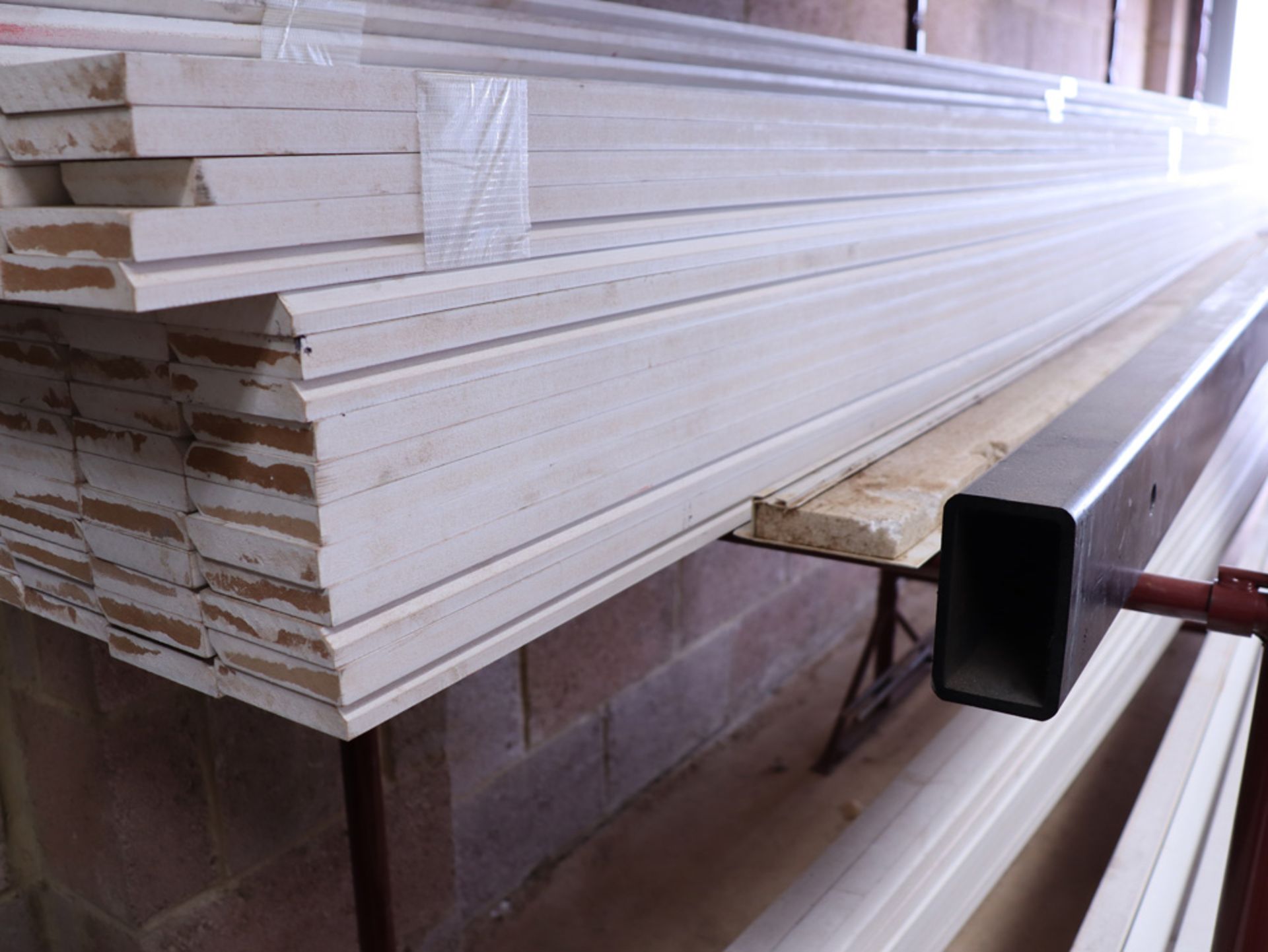 Large quantity of 5.4m length white painted MDF skirting