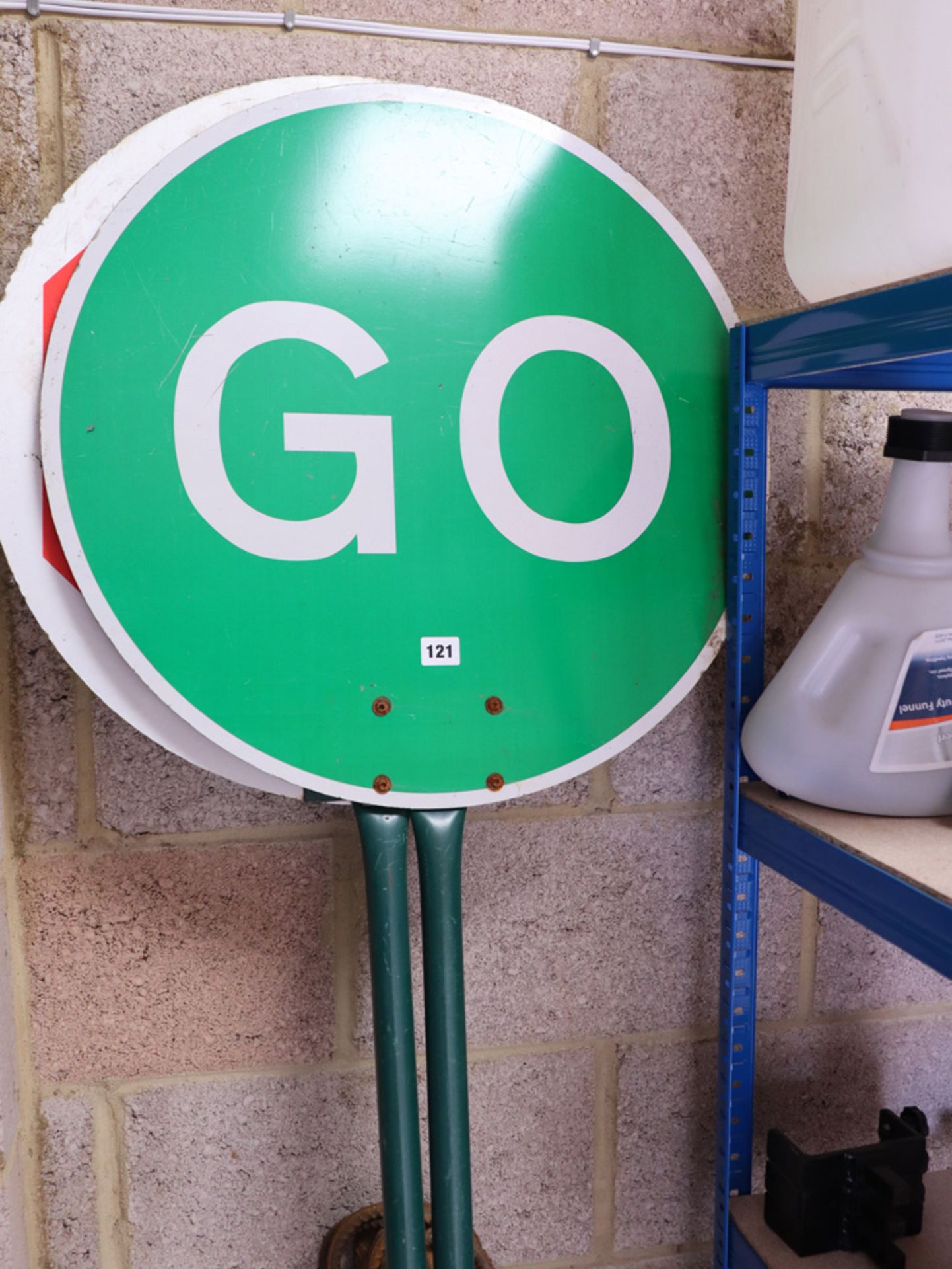 2 road workers stop and go signs