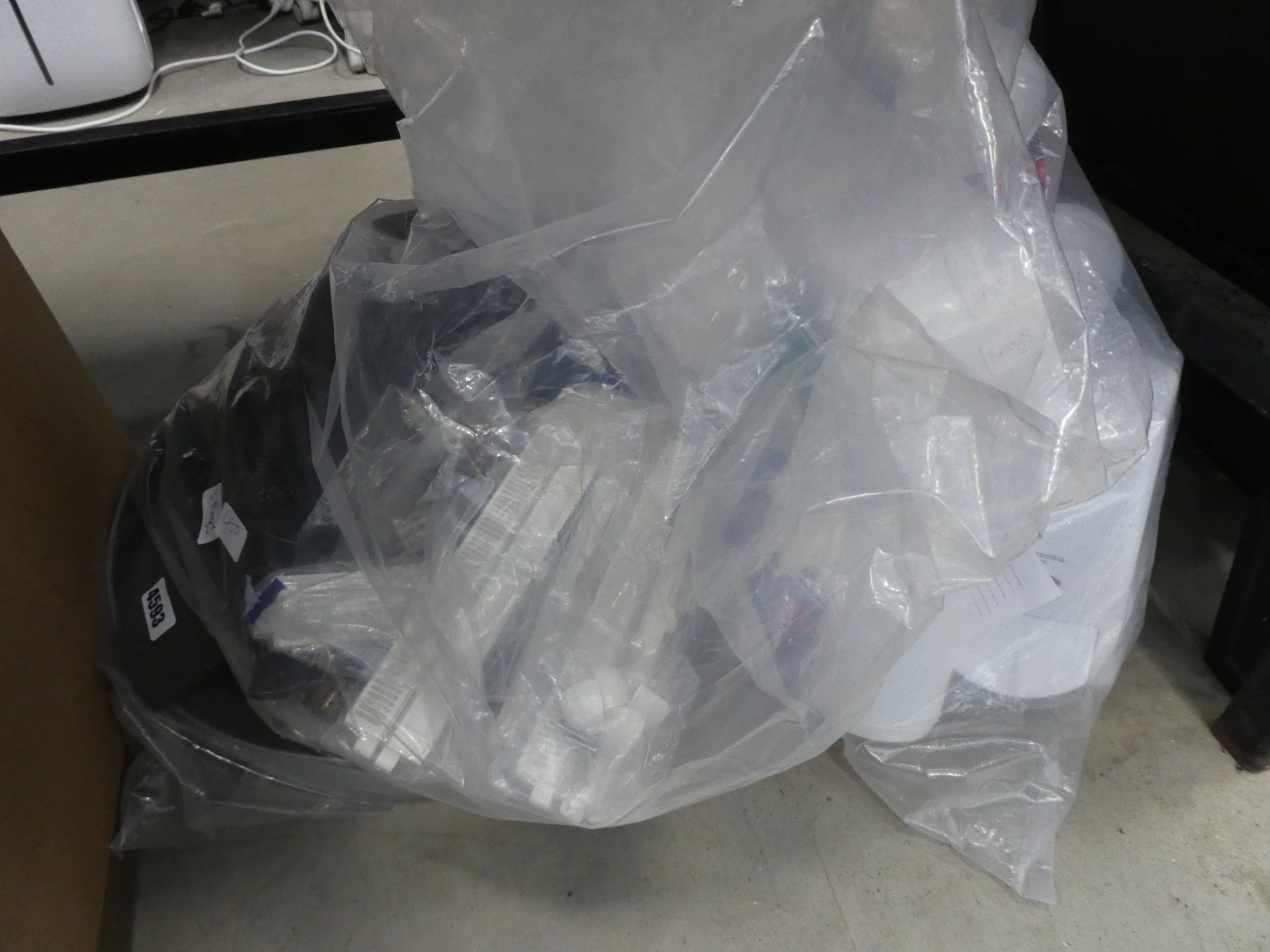 3 bags containing hand cleaner, water bottles, window vents, rubber hose, etc