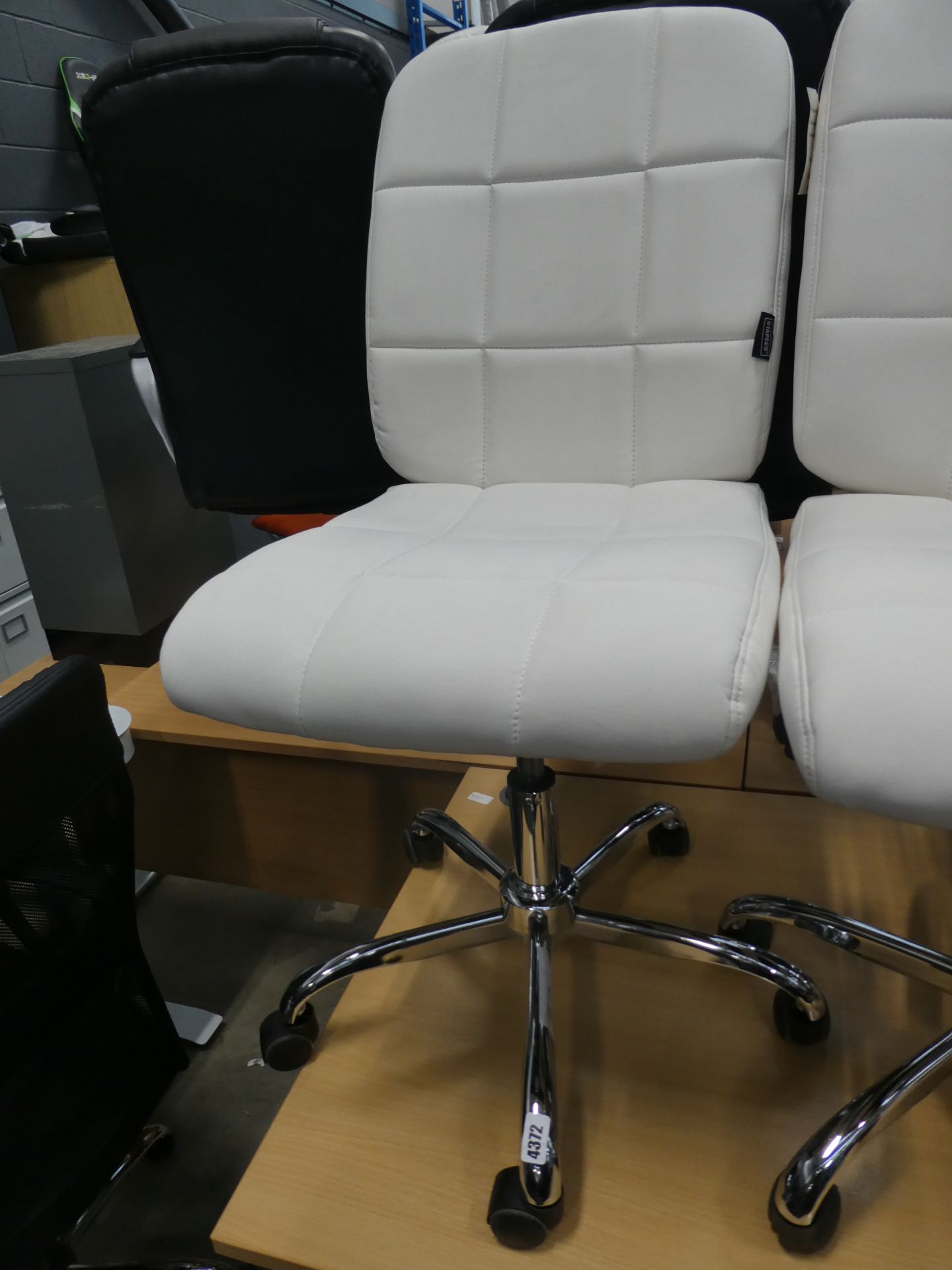 White chrome based swivel chair