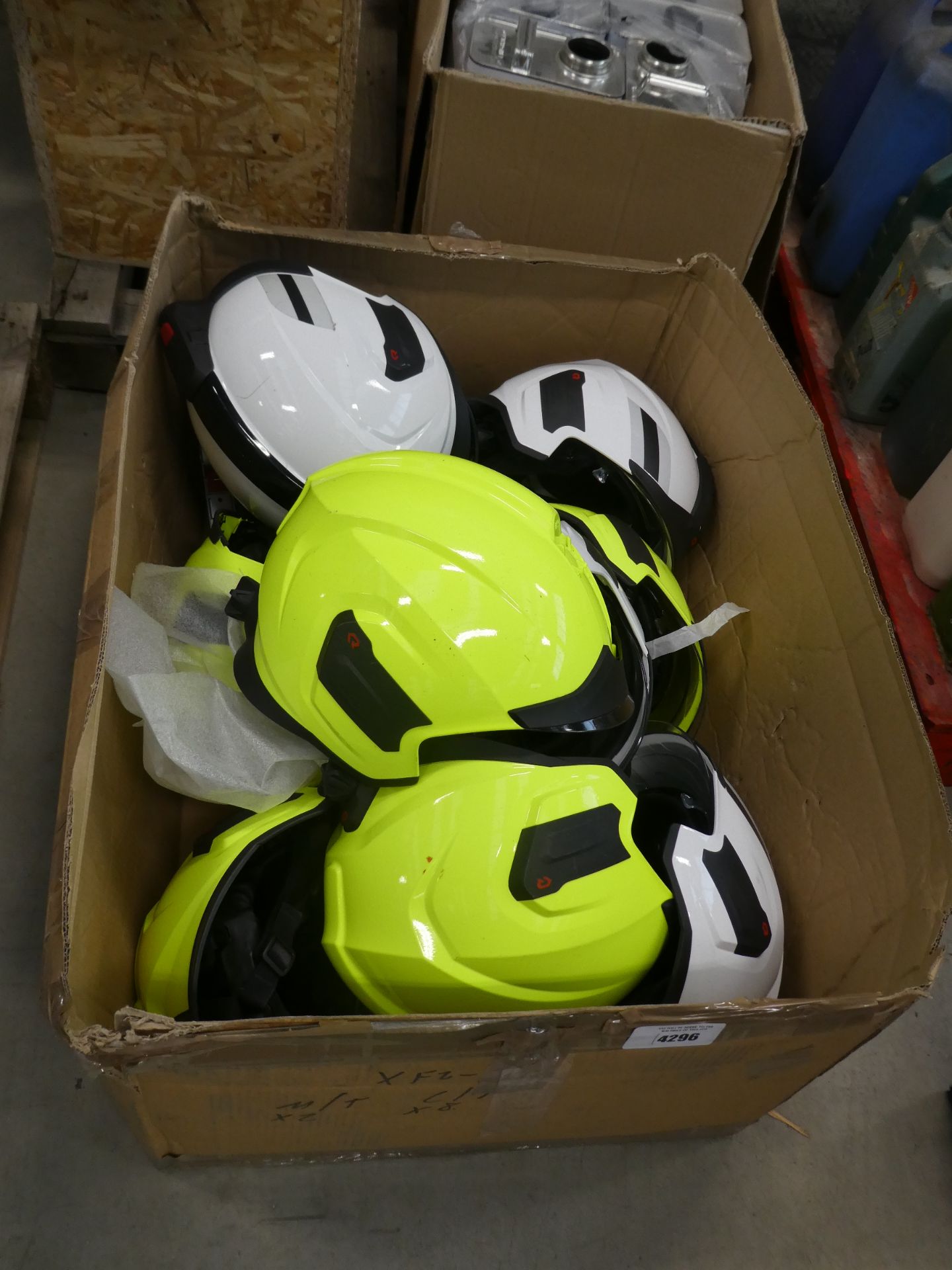 Large box containing approx ten fireman's helmets